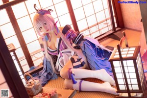 A woman in a kimono sitting on a bench.
