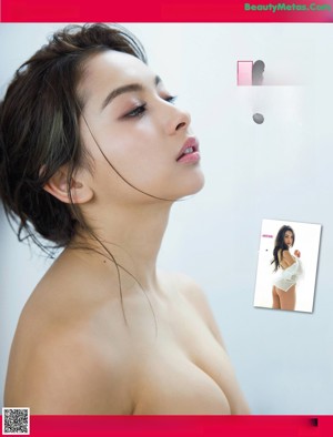 A woman in a white lingerie posing for a picture.